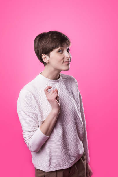 istock Let me think. Doubt concept. Doubtful pensive woman with thoughtful expression making choice 944801504