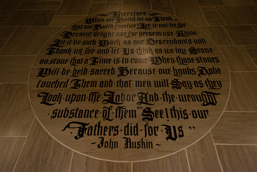 Chicago, USA – Mar, 15 2018: The floor inscription on the lobby floor of the Historic Tribune Tower on Michigan avenue late in the day.