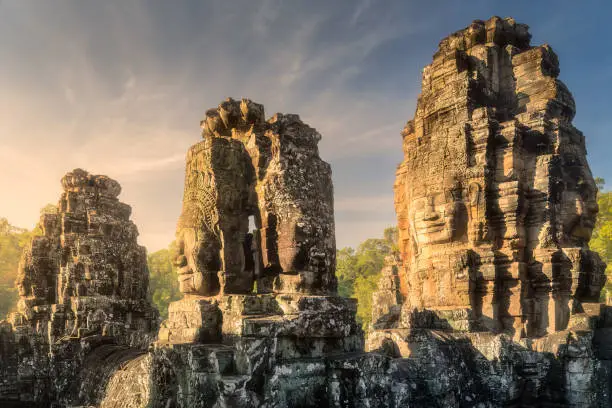 Sunrise view of ancient temple Bayon Angkor complex with stone faces of buddha Siem Reap, Cambodia