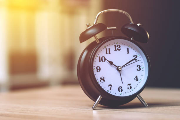 istock Vintage clock on business office table 944811942