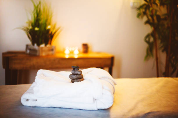 istock White bathrobe on the bed in the spa salon 944812002