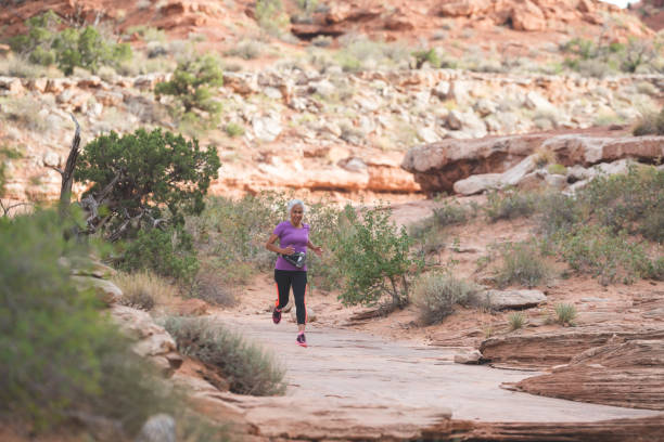 istock Senior woman going for a trail run in the desert 944812422