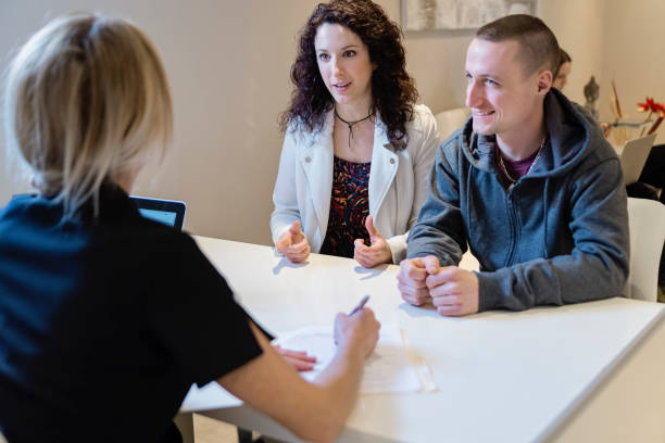 istock Young couple in a consultation in small office. 944818854