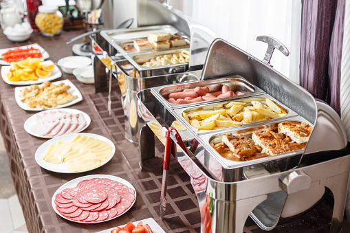 Buffet heated trays ready for service. Breakfast in hotel smorgasbord