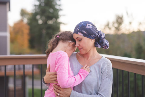 istock Mother with cancer hugging her daughter 944834554