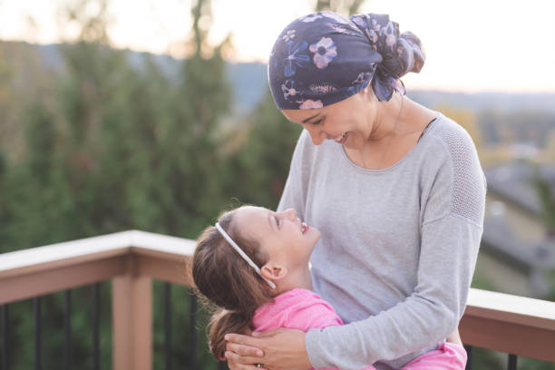 istock Mother with cancer hugging her daughter 944834566