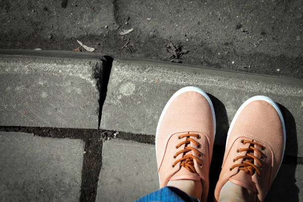 istock Sneakers on the road monochrome 944834832