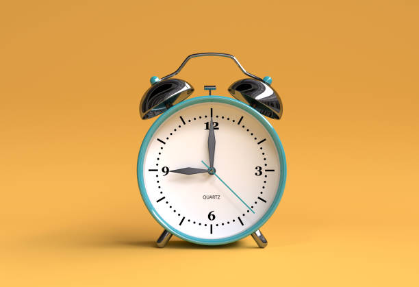 istock old alarm clock on yellow background - 9 o'clock - 3d illustration rendering 944837866
