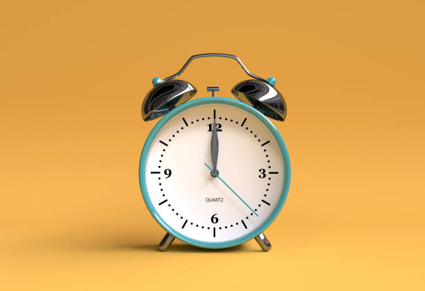 istock old alarm clock on yellow background - 12 o'clock - 3d illustration rendering 944837908