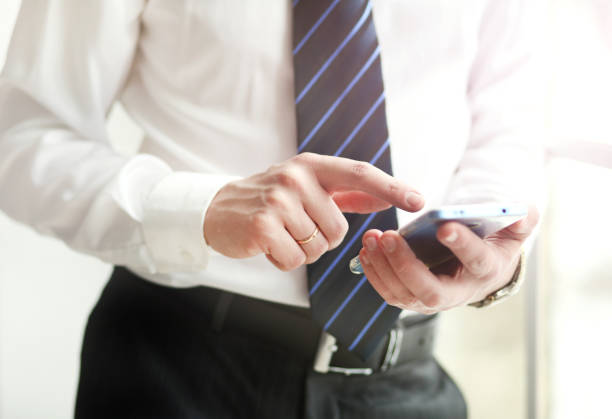 istock Close up of a man using mobile smart phone 944840672