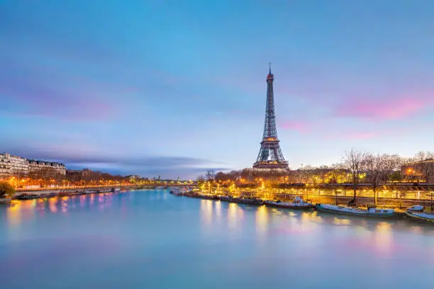 Photo of The Eiffel Tower and river Seine at twilight in Paris