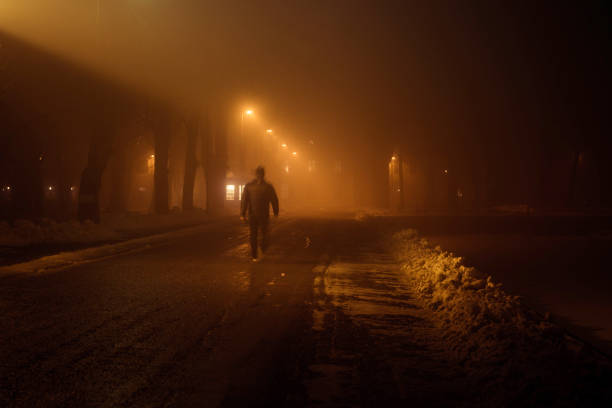 istock man walking down a misty street 944847490