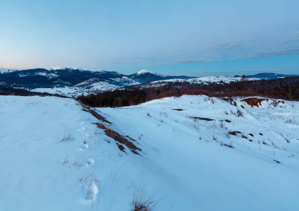 istock Evening twilight winter mountain ridge panorama 944852156