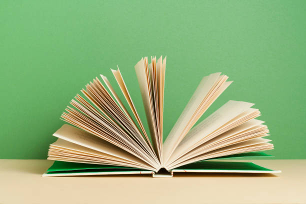 istock Open book on wooden table. Education background. Back to school. 944852298