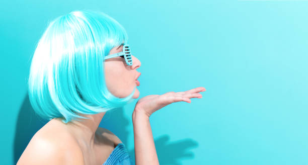 istock Beautiful woman in a bright blue wig 944864592