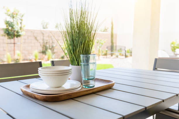 istock Outdoor Patio Setting with Dishes and Glasses on Tray 944867860