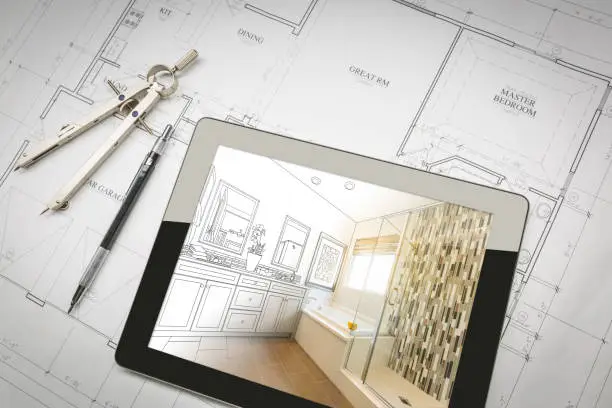 Photo of Computer Tablet with Master Bathroom Design Over House Plans, Pencil and Compass.