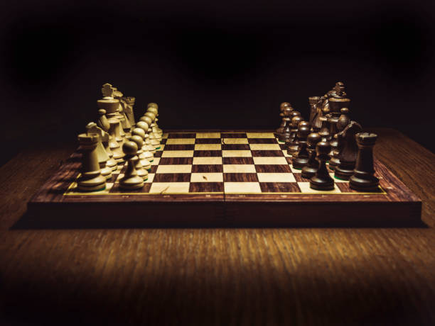 istock chess board on the table, first move close-up shot