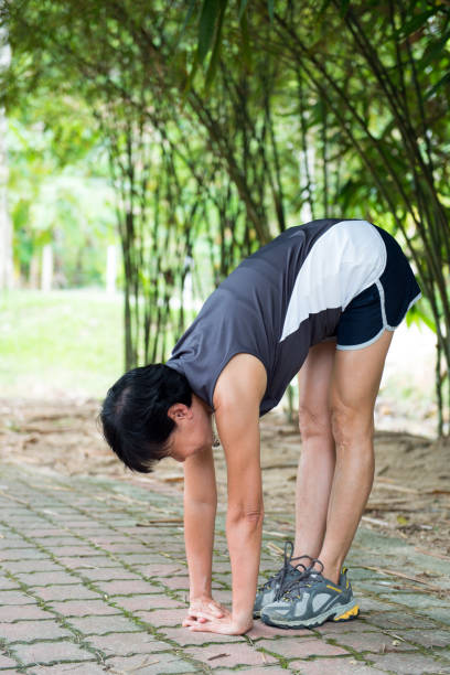 istock Senior woman exercising in park 944868944