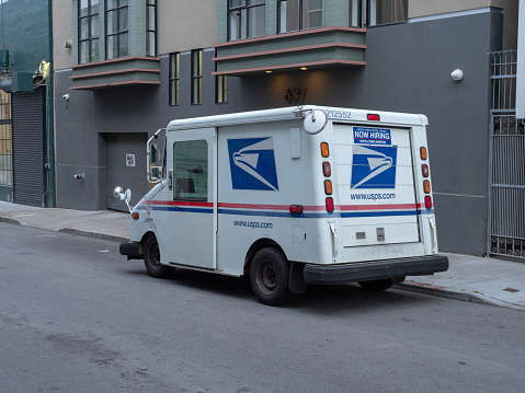 SAN FRANCISCO, CA - APRIL 4, 2018: United States Postal Service delivery truck in the city. Advertising USPS hiring on the back