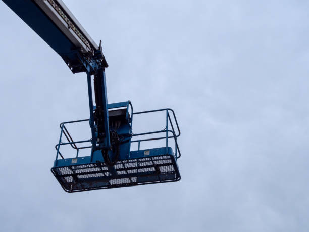 istock Human basket attached to end of crane 944871568