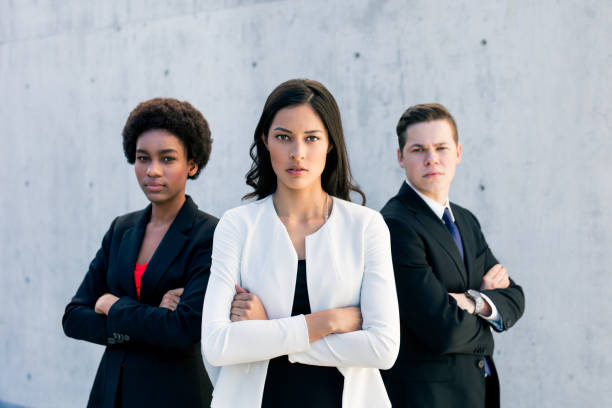 istock Multi-ethnic group of three standing and looking at camera 944871858