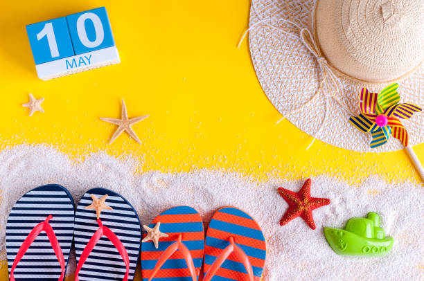 istock May 10th. Image of may 10 calendar with summer beach accessories. Spring like Summer vacation concept 944877274