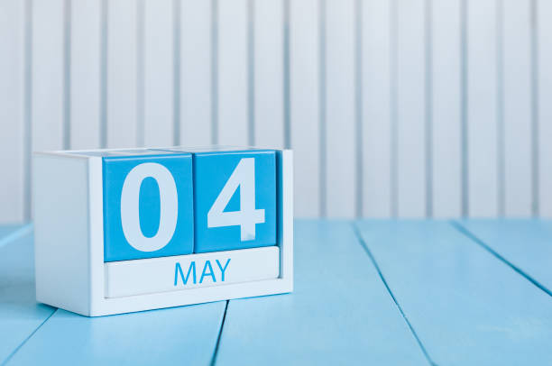 istock May 4th. Image of may 4 wooden color calendar on white background.  Spring day, empty space for text.  International or World Press Freedom Day 944879772