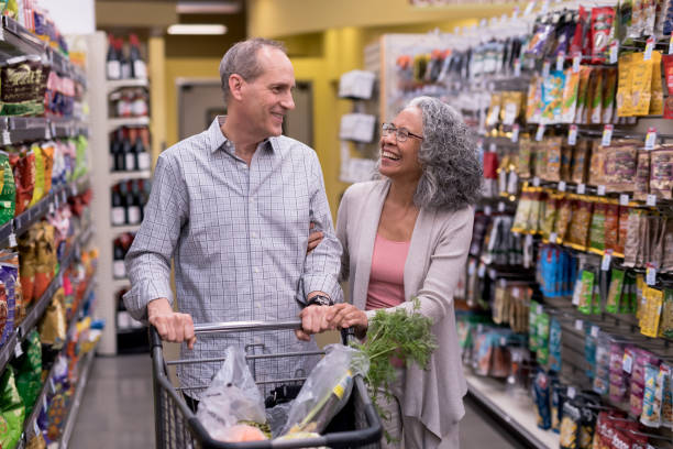 istock Senior Couple Grocery Shopping Together 944882690