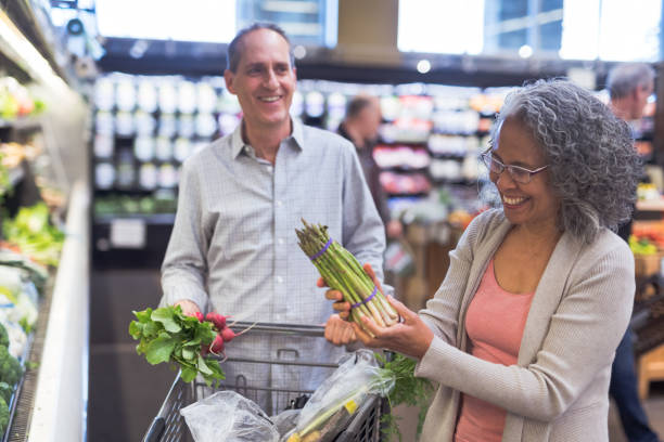 istock Senior Couple Grocery Shopping Together 944882696