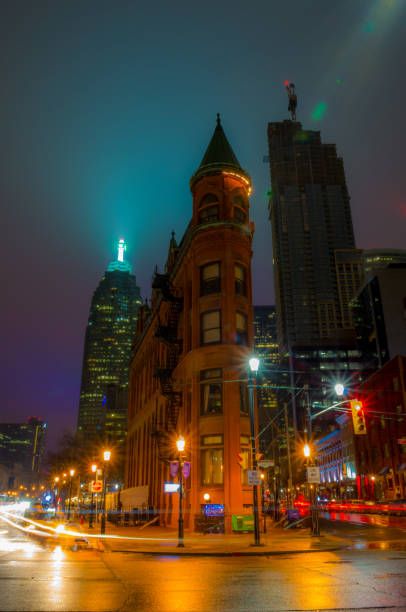 City in rain Gooderham Building at Toronto, ON, Canada flatiron building toronto stock pictures, royalty-free photos & images