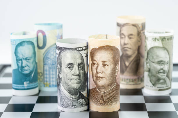 US Dollar and China bank roll at front surrund with world major countries, india, japan, europe and uk on chessboard, US and China trade war, global financial economy concept stock photo