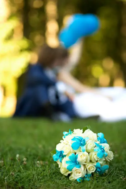 Flowers and just married couple outdoors