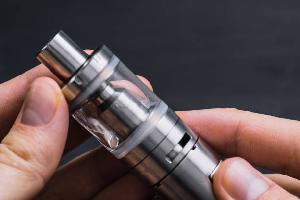 istock Close-up Of Man Hand Holding Electronic Cigarette. 944890774