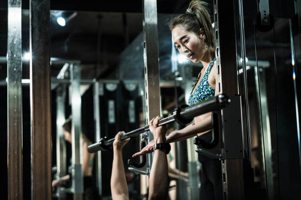 istock Muscle man training hard at the gym 944903568