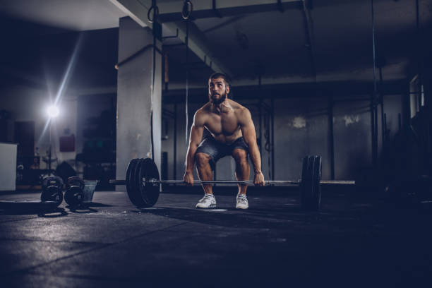istock Guy weightlifter in gym 944911068