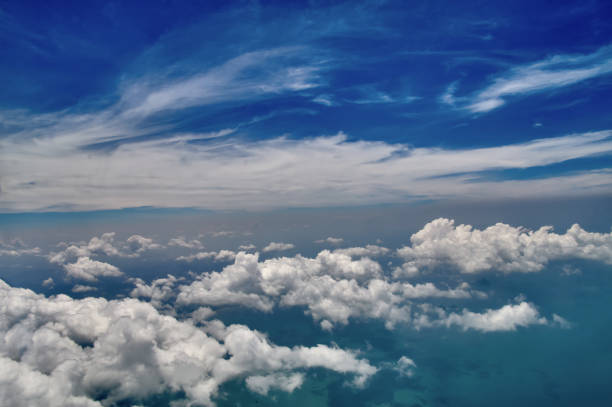 istock Beautiful blue sky and white clouds background. Sky atmosphere panorama. Heavenly bright daylights. Outdoor planet. Photo from the aircraft window. 944911202
