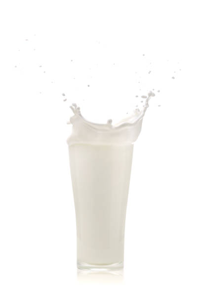 istock splash of milk in a glass on White background 944913832