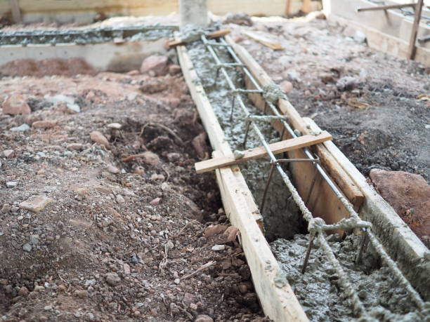 istock Steel reinforcement wooden framework for concrete pouring build in construction site 944914418
