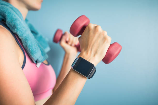 istock Woman holding dumbbells 944914896