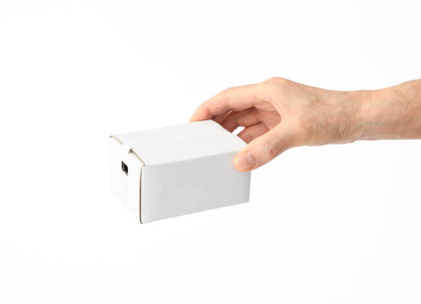 istock Isolated shot of holding a small blank cardboard box on white background 944919928
