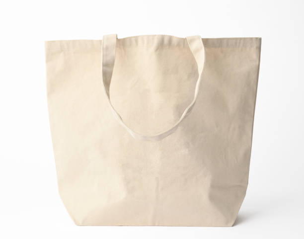 istock Isolated shot of blank canvas tote bag on white background 944919954