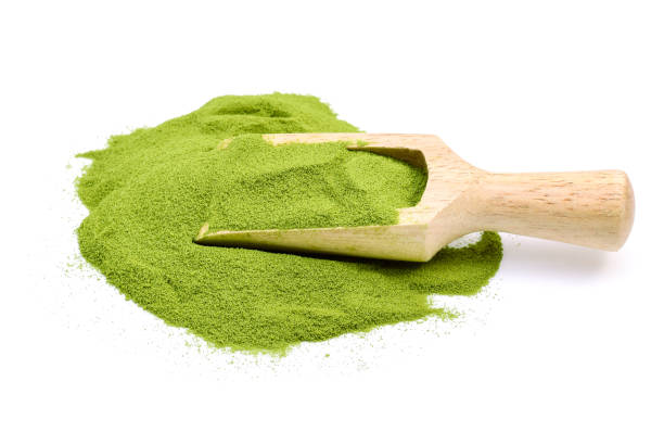 istock powder green tea isolated on white background 944923328