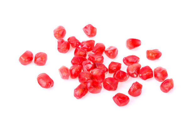 istock Pomegranate seed pile isolated on white background 944928430