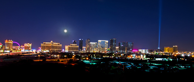 Las Vegas skyline with a full moon at night.