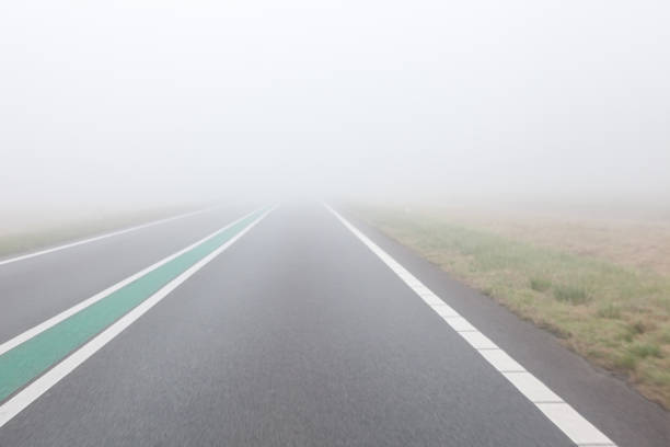 istock driving on a foggy road 944942384