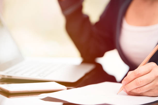 istock business woman writing 944942882