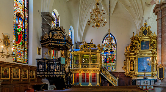 Stained glass windows, the altar, the pulpit and the 