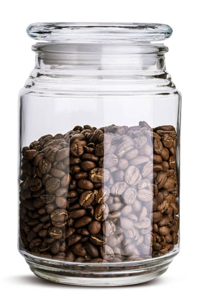istock Glass jar with coffee beans isolated. Clipping path. 944950516