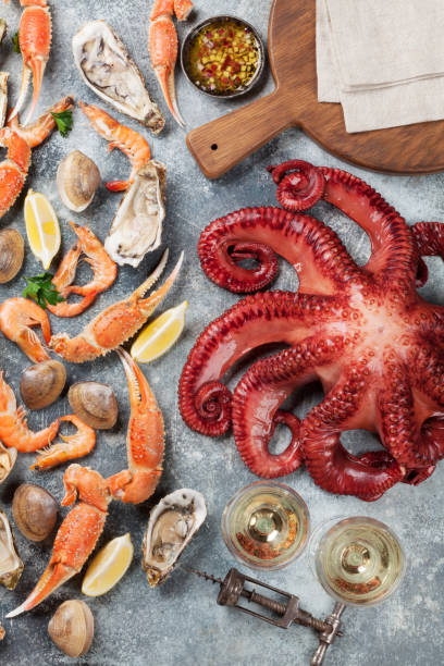 istock Seafood and wine. Octopus, lobster, shrimps 944951022